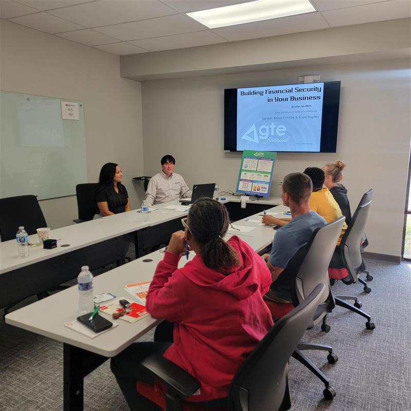 man presenting on a dry erase board